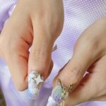 Hand Wearing Nail Art Sticker Pass Astronaut - Image 4